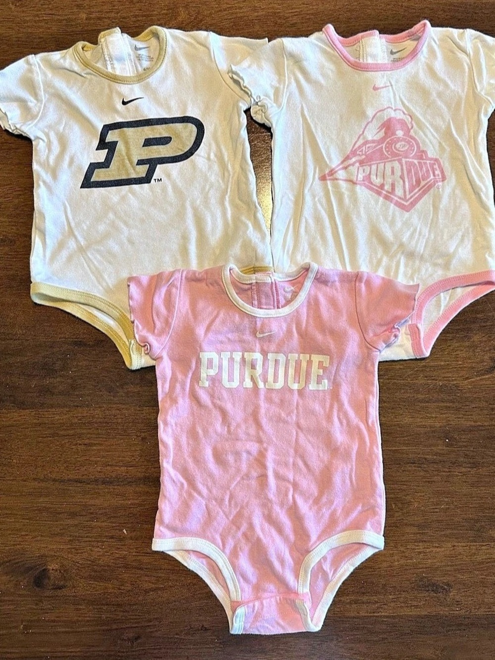 3 piece bundle of Nike Purdue Onesies size 6/9m Pink & White